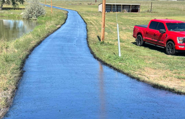 fresh sealcoating on asphalt driveway